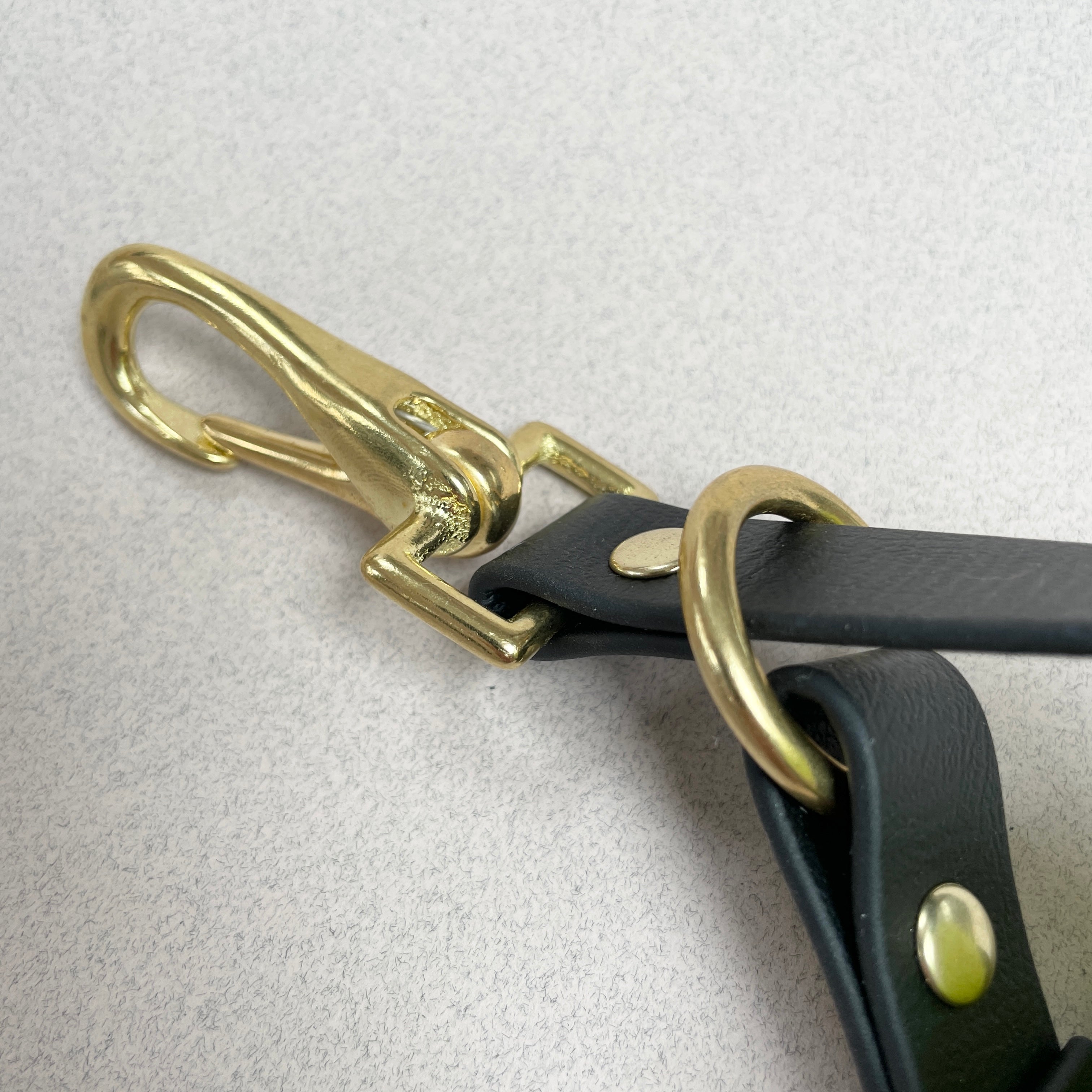 Oonalfie ball holster attached to rope dog lead, keeping fetch toy secure on walks