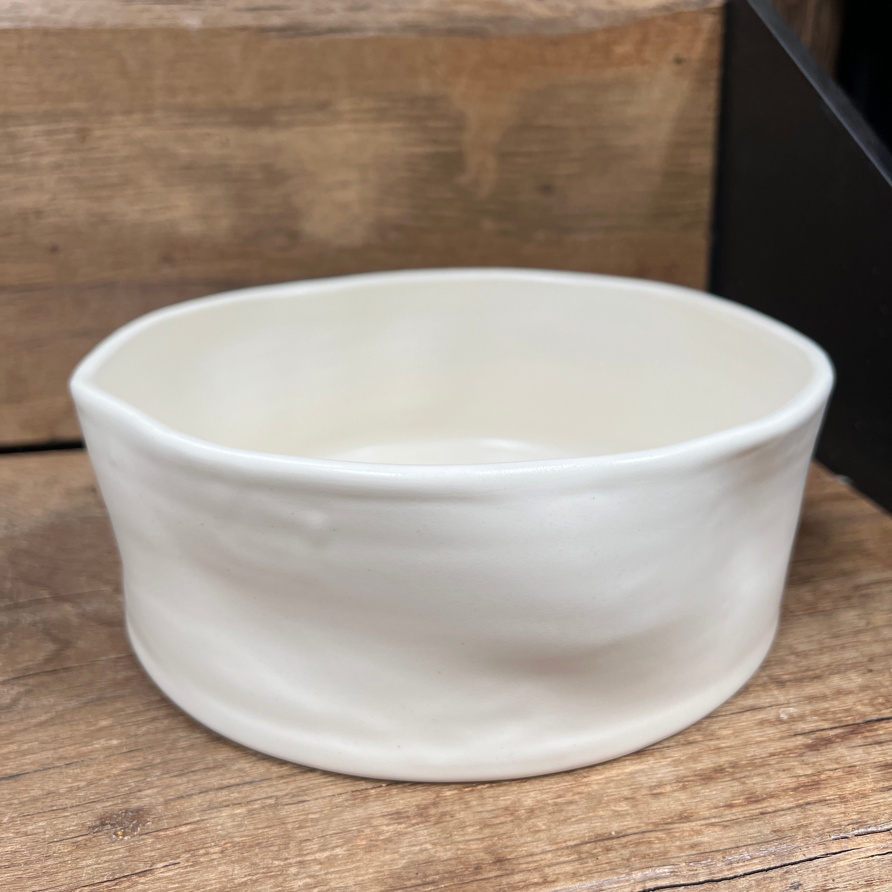 Oonalfie Wibble dog bowl showing white food-safe glaze and handcrafted organic form, no two alike