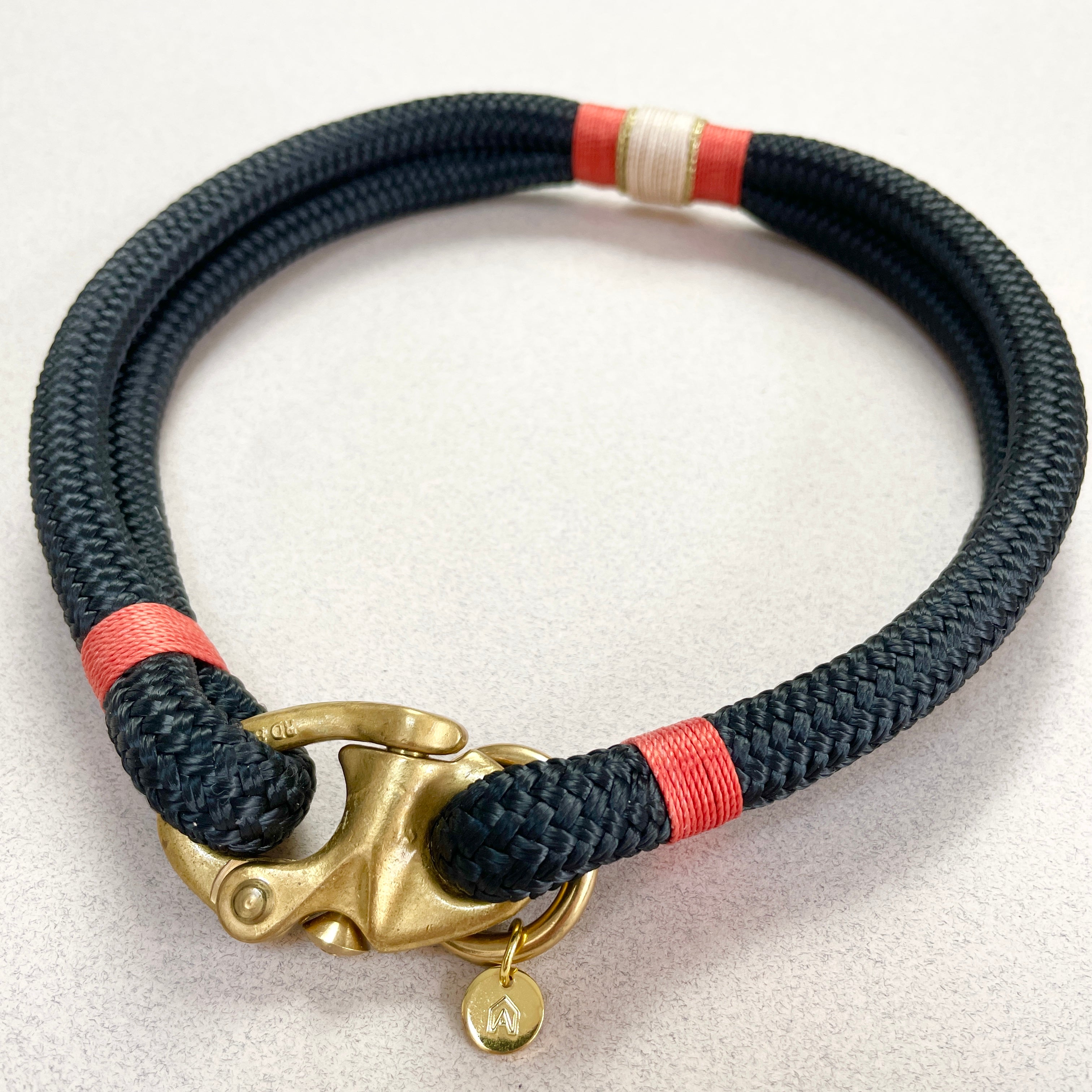 Close-up of Himalayan collar showing red, white and brass accent detail