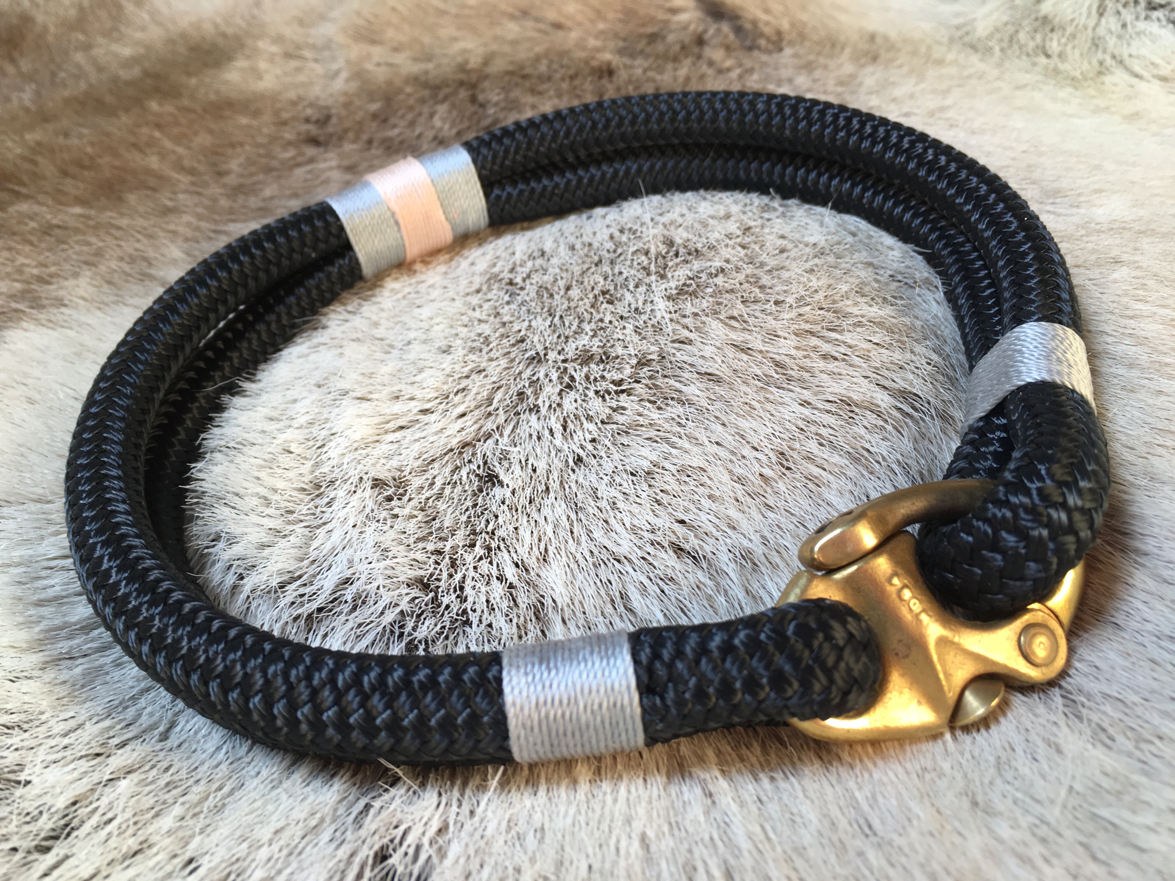 Close-up of Seychelles collar showing blush pink and ocean blue whipping detail