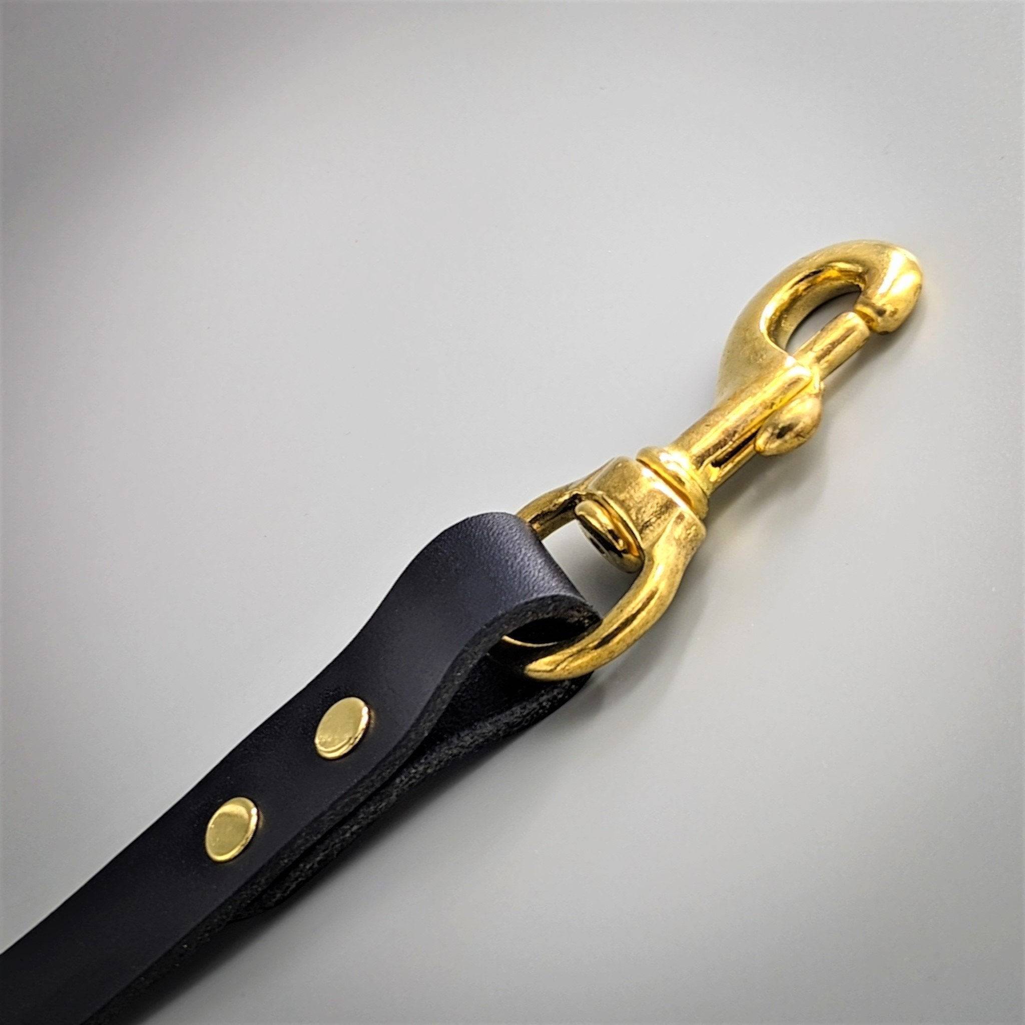 Close up of a Cub & Grey black leather dog lead with brass hardware