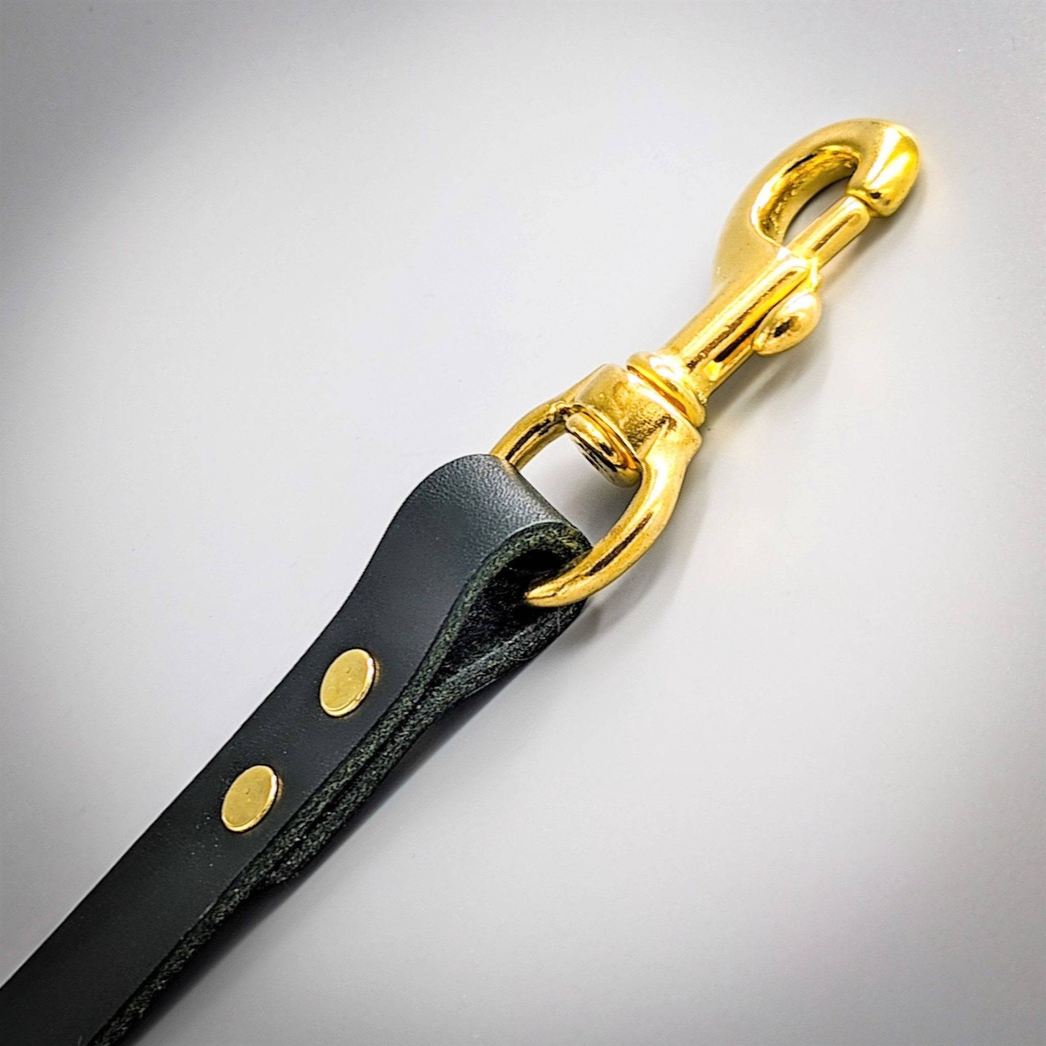 Close up of a Cub & Grey Jet Black leather dog lead with brass clip