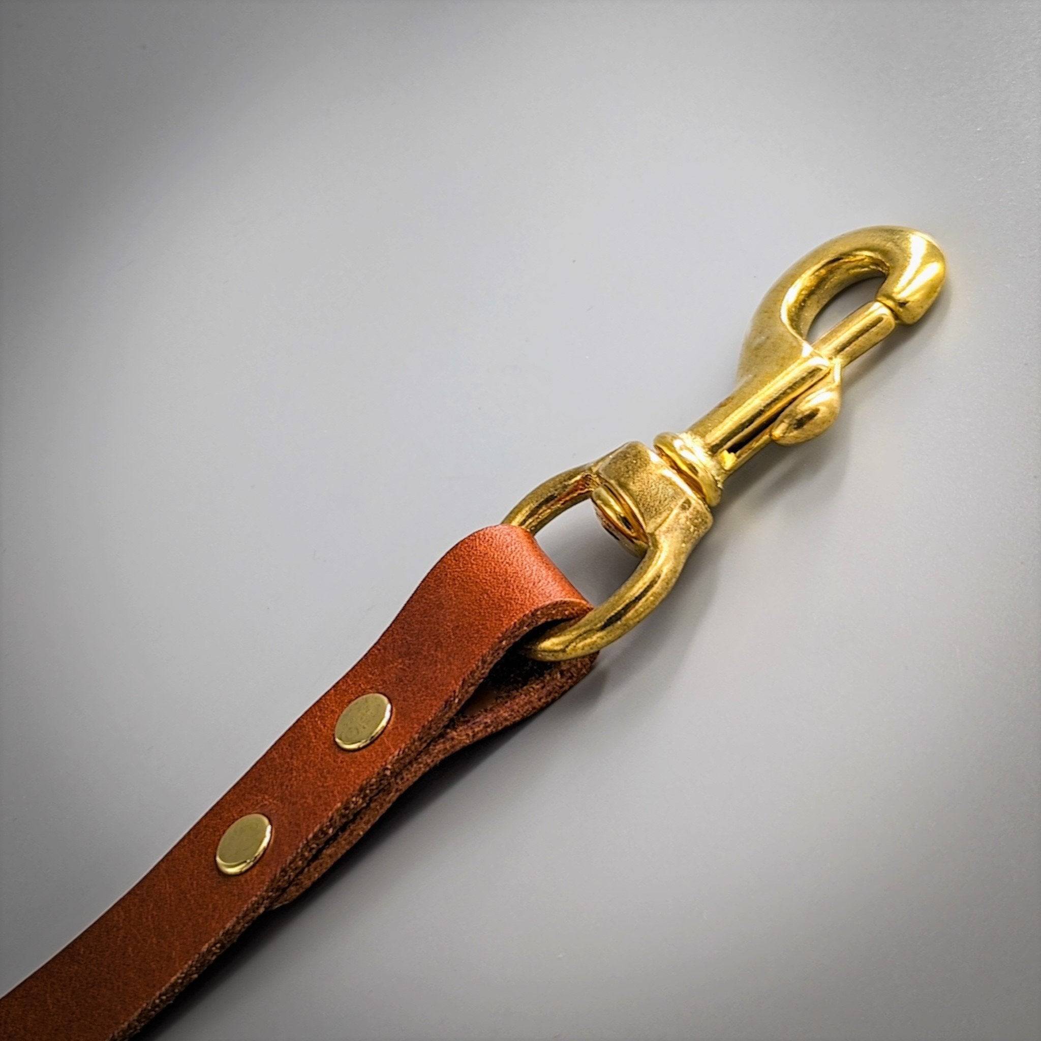 Close-up of a Cub & Grey Whisky Tan leather dog lead with brass clip