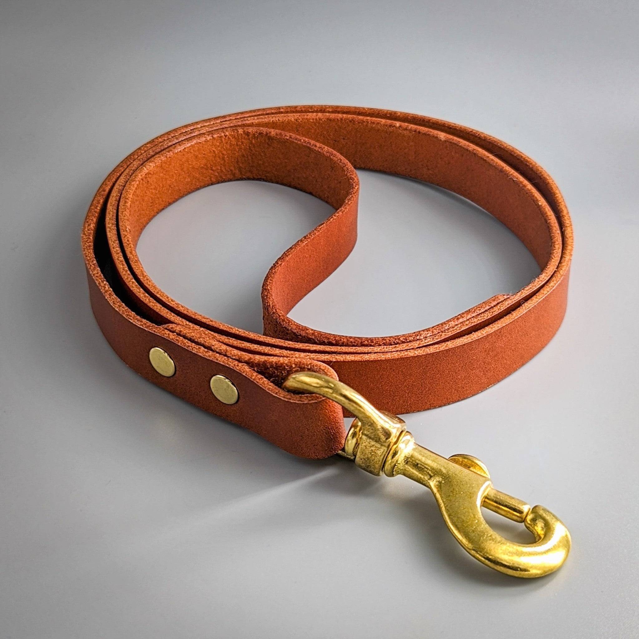 Cub & Grey Whisky Tan leather dog lead with brass clip on grey background
