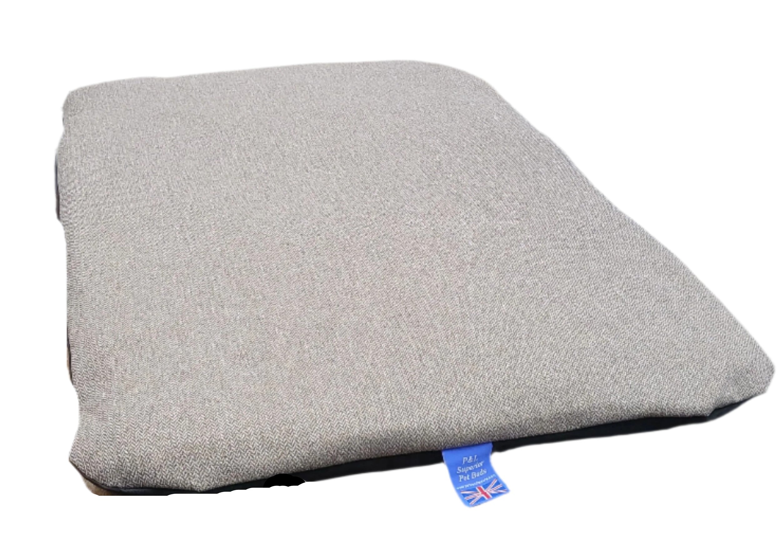 Grey Orkney tweed dog bed with removable cover showing British flag quality label on dark base