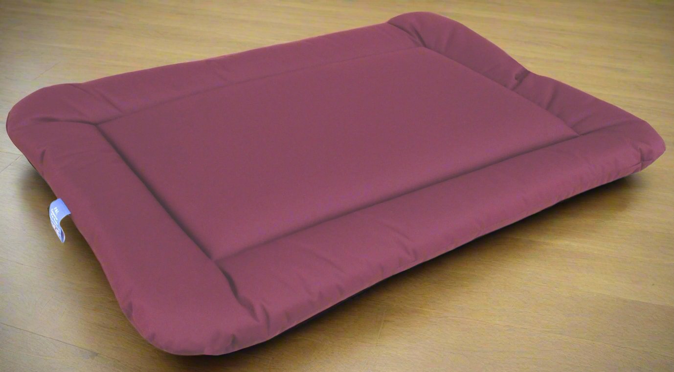 P&L Country Dog burgundy waterproof rectangular cushion pad dog bed on wooden floor showing durable design