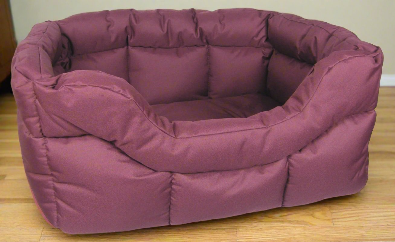 Country Dog rectangular waterproof dog bed in burgundy with high sides and quilted padding on wooden floor