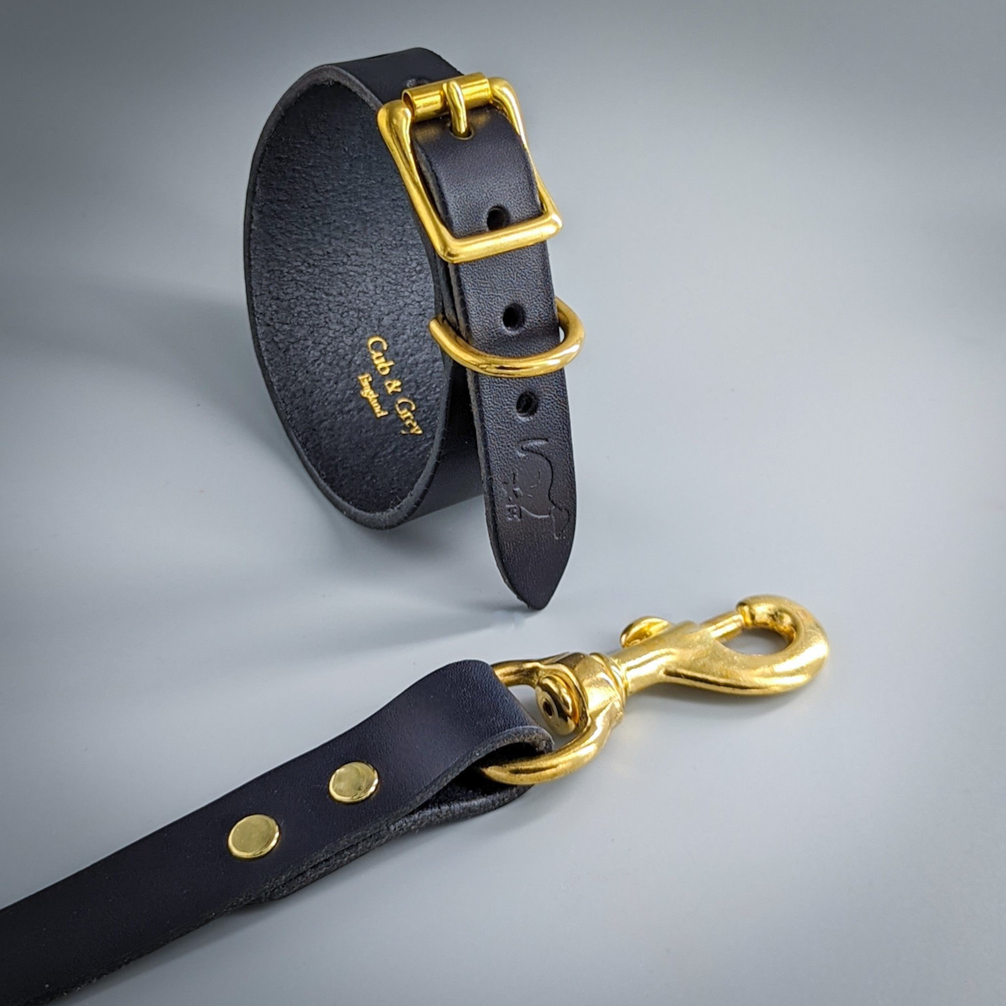 Luxury black leather dog collar and lead set with gold hardware, handcrafted British premium pet accessories