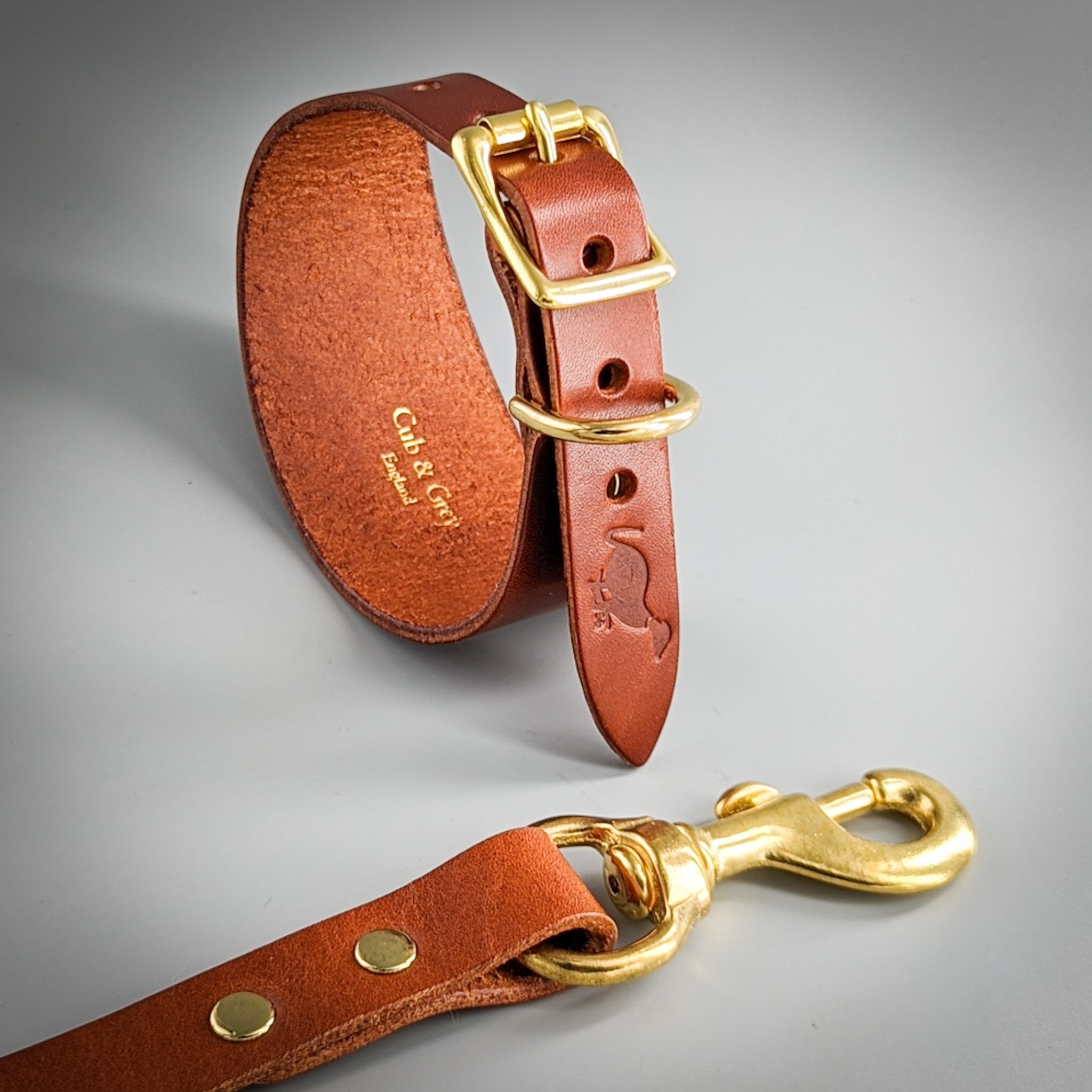 Brown leather handcrafted whippet collar lead set with gold-toned hardware and bespoke interior embossing