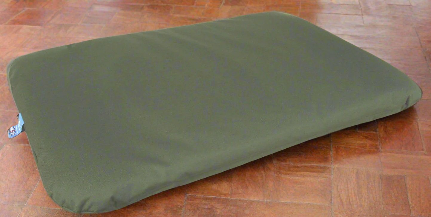 Olive green P&L Country Dog waterproof duvet bed on wooden floor showing durable fabric construction