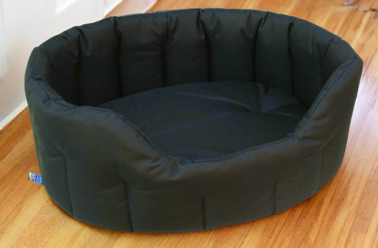 Black oval waterproof dog bed with high sides and quilted interior, heavy duty design for comfortable pet sleeping