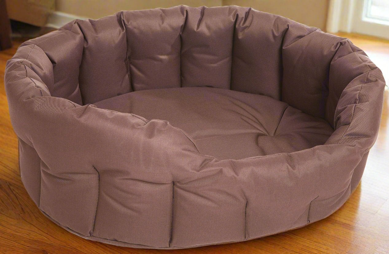 P&L Country Dog heavy duty oval waterproof dog bed in brown fabric with high sides on wooden floor