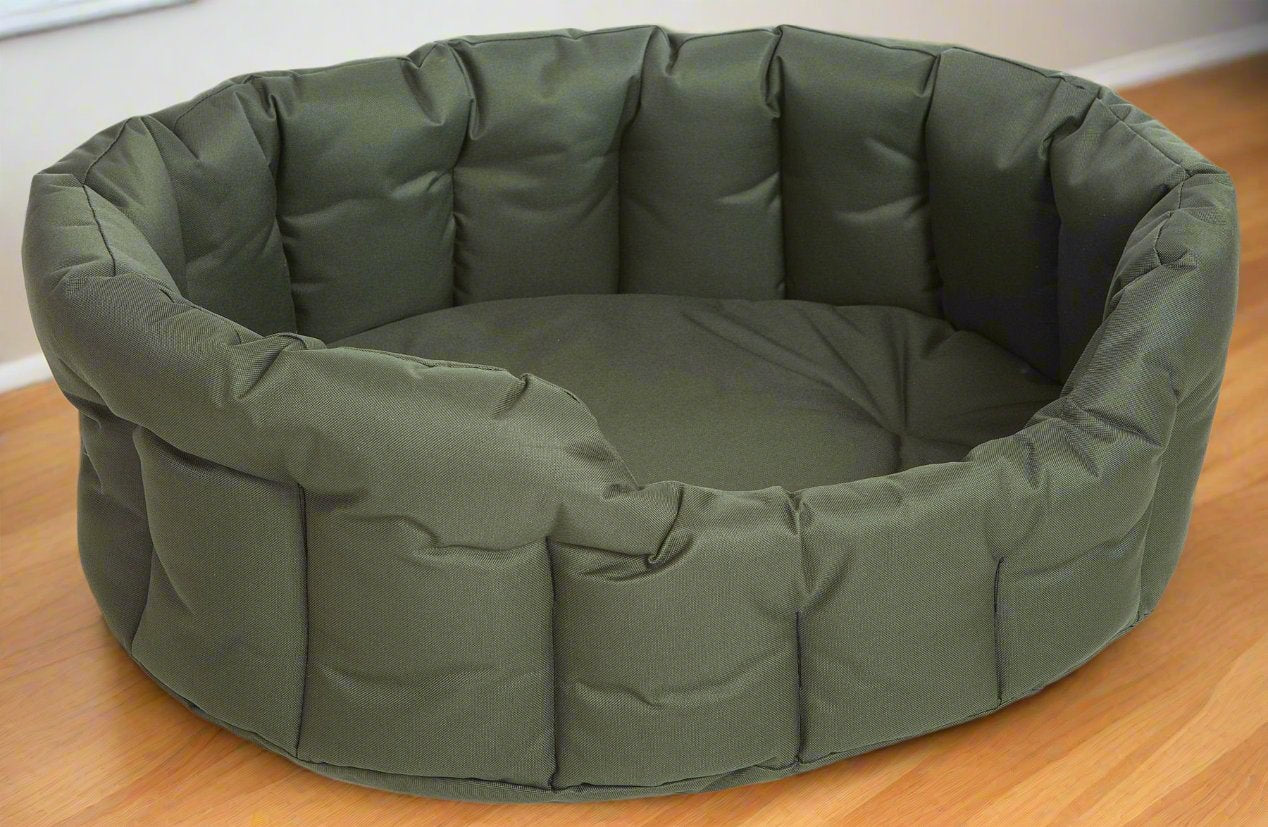 Olive green P&L Country Dog heavy duty oval waterproof dog bed with high padded sides on wooden floor