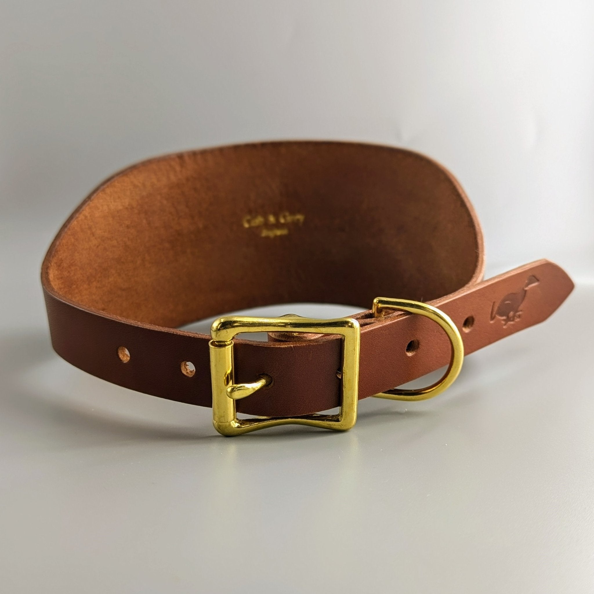 Brown leather dog collar with brass square buckle, rivets and adjustment holes for large breed hounds