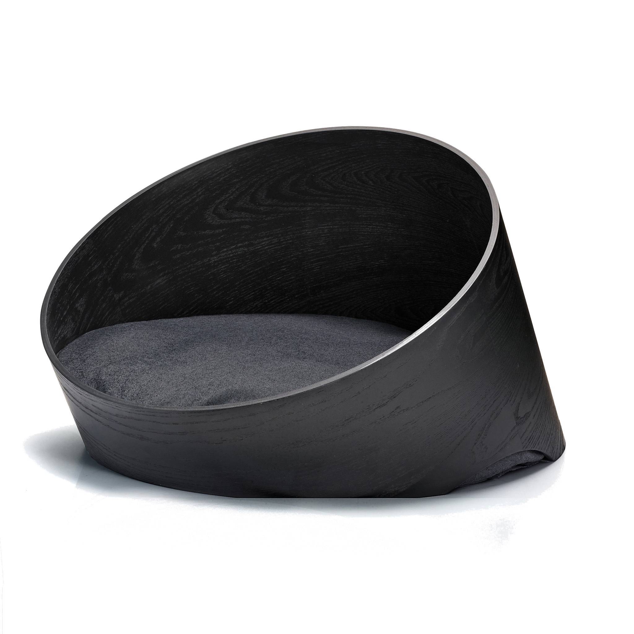 Modern black wooden dog basket with minimalist design and grey cushion, showcasing German craftsmanship and style
