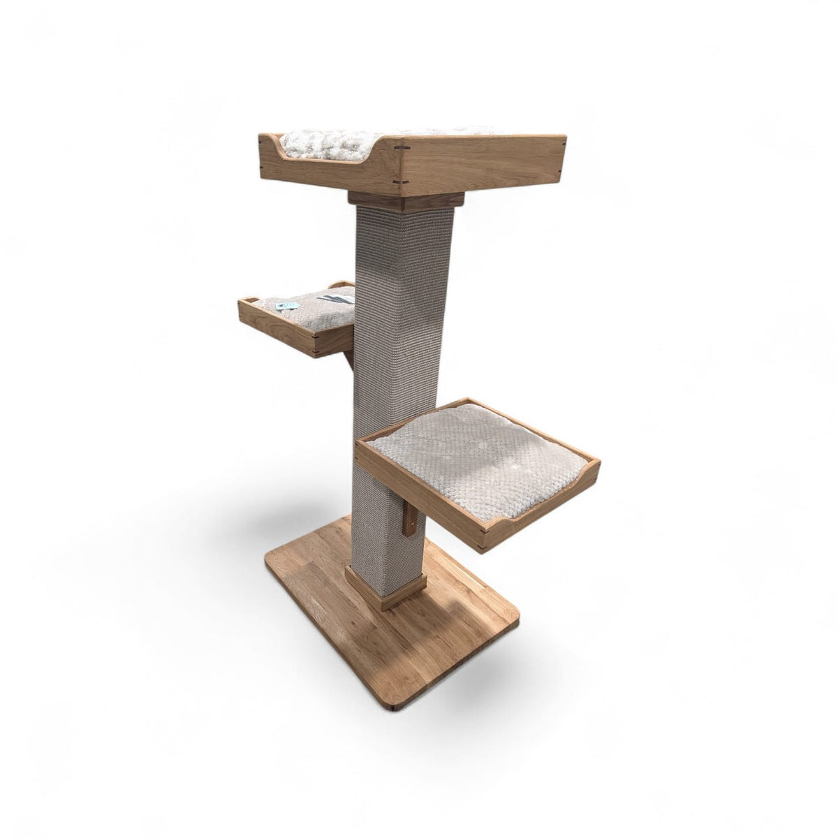 Handmade three-bed cat tree seen from the side, showing the beds at different heights