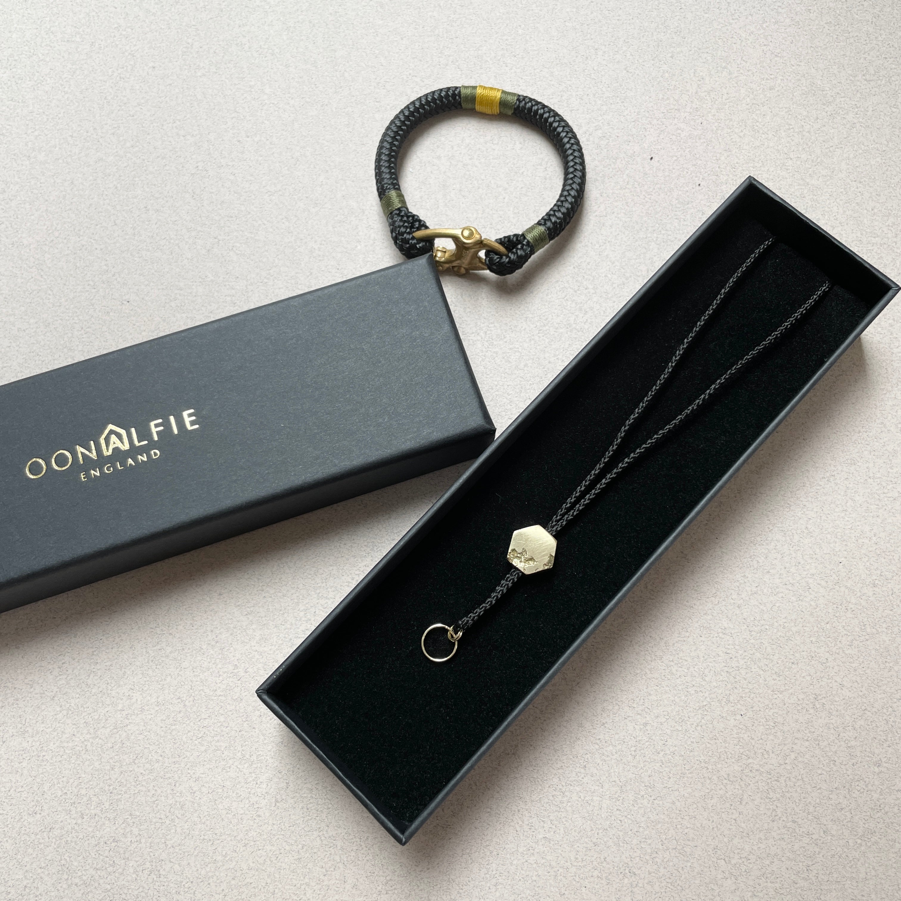 Oonalfie whistle lanyard in eco-friendly kraft packaging with brand card