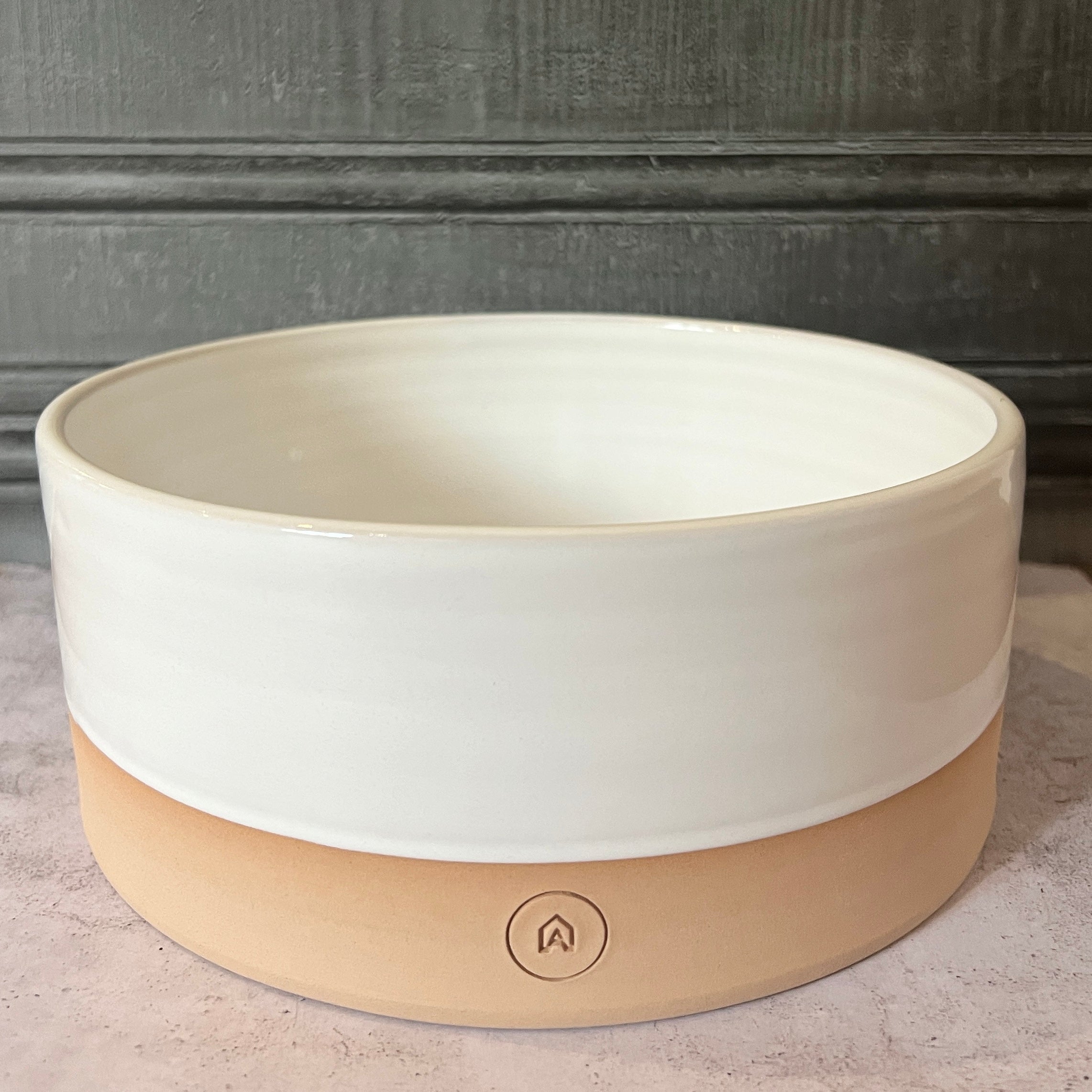 Oonalfie terracotta dog bowl in rose glaze, handmade by Emma in Berkshire from chip-resistant stoneware