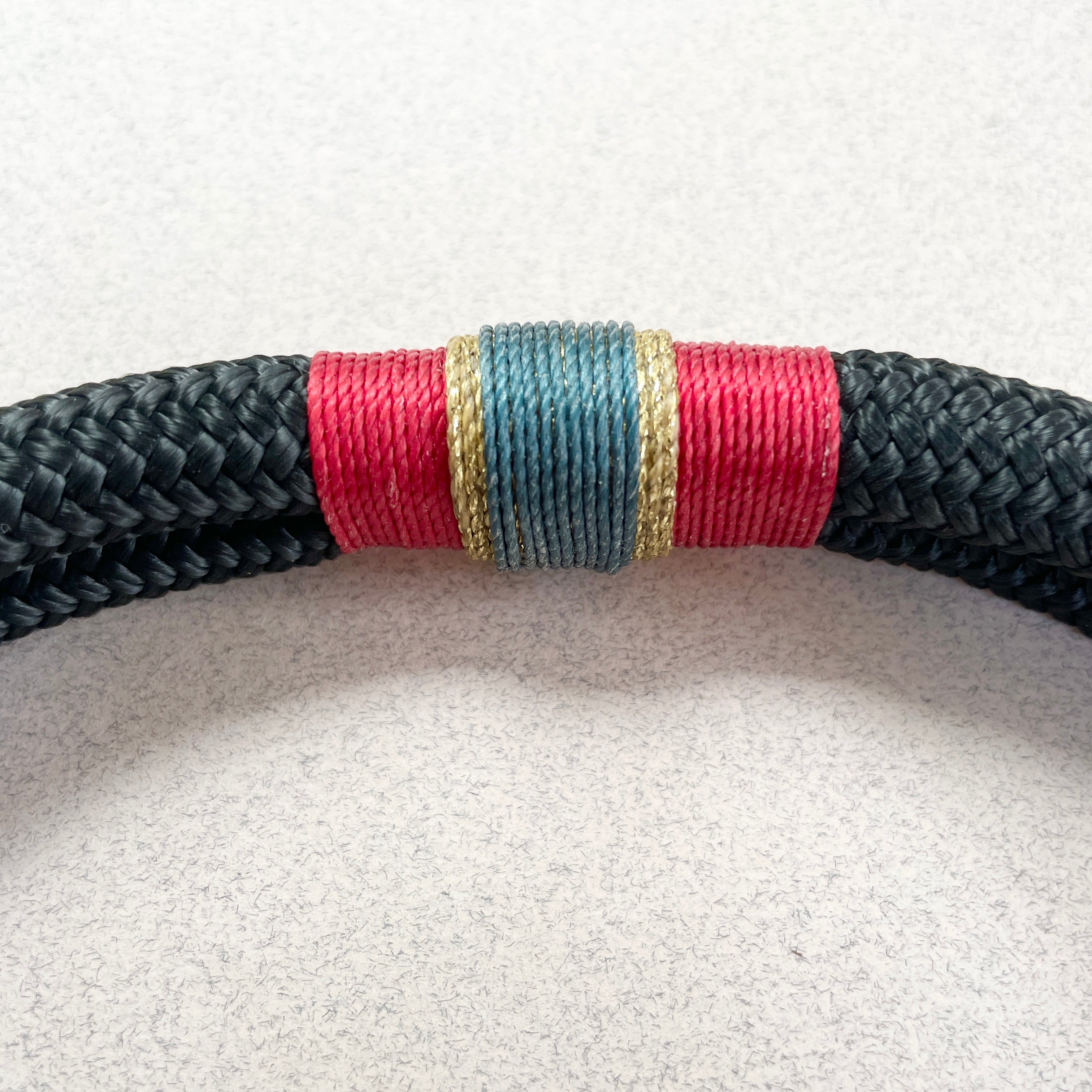 Royal small rope collar in luxury gift box with black ribbon on wooden surface
