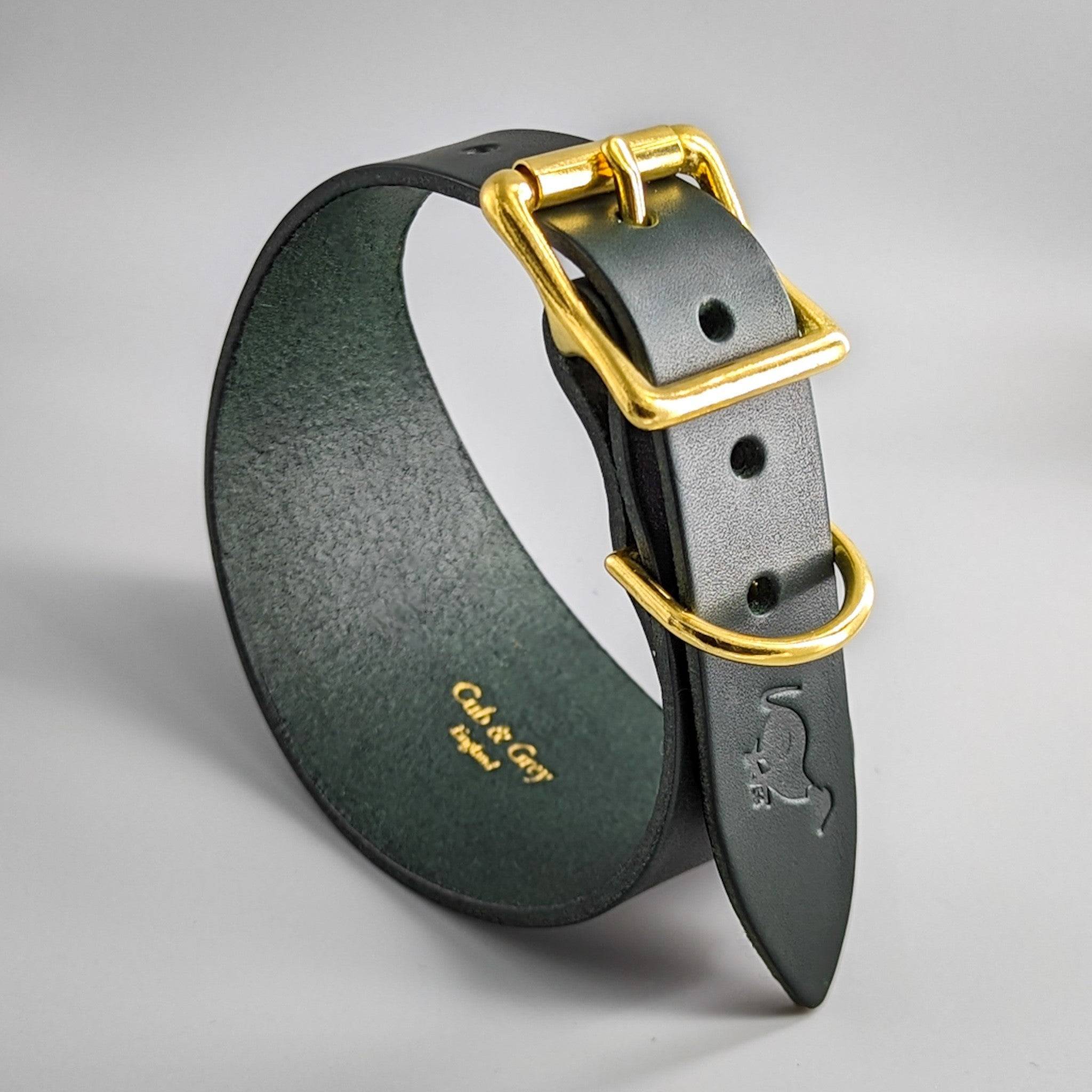 Black leather dog collar forest green suede lining brass hardware, luxury craftsmanship contrast golden fittings