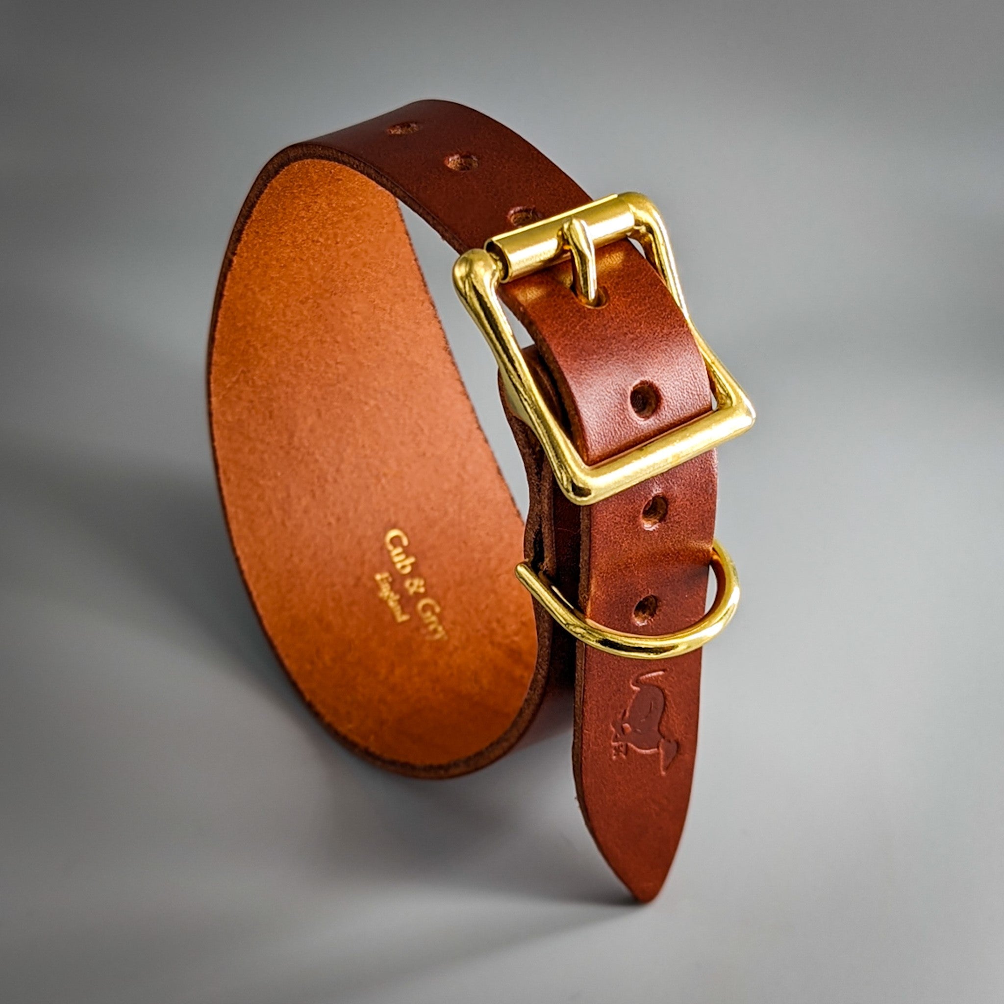 Brown leather handcrafted whippet collar with brass square buckle and orange interior lining stitching