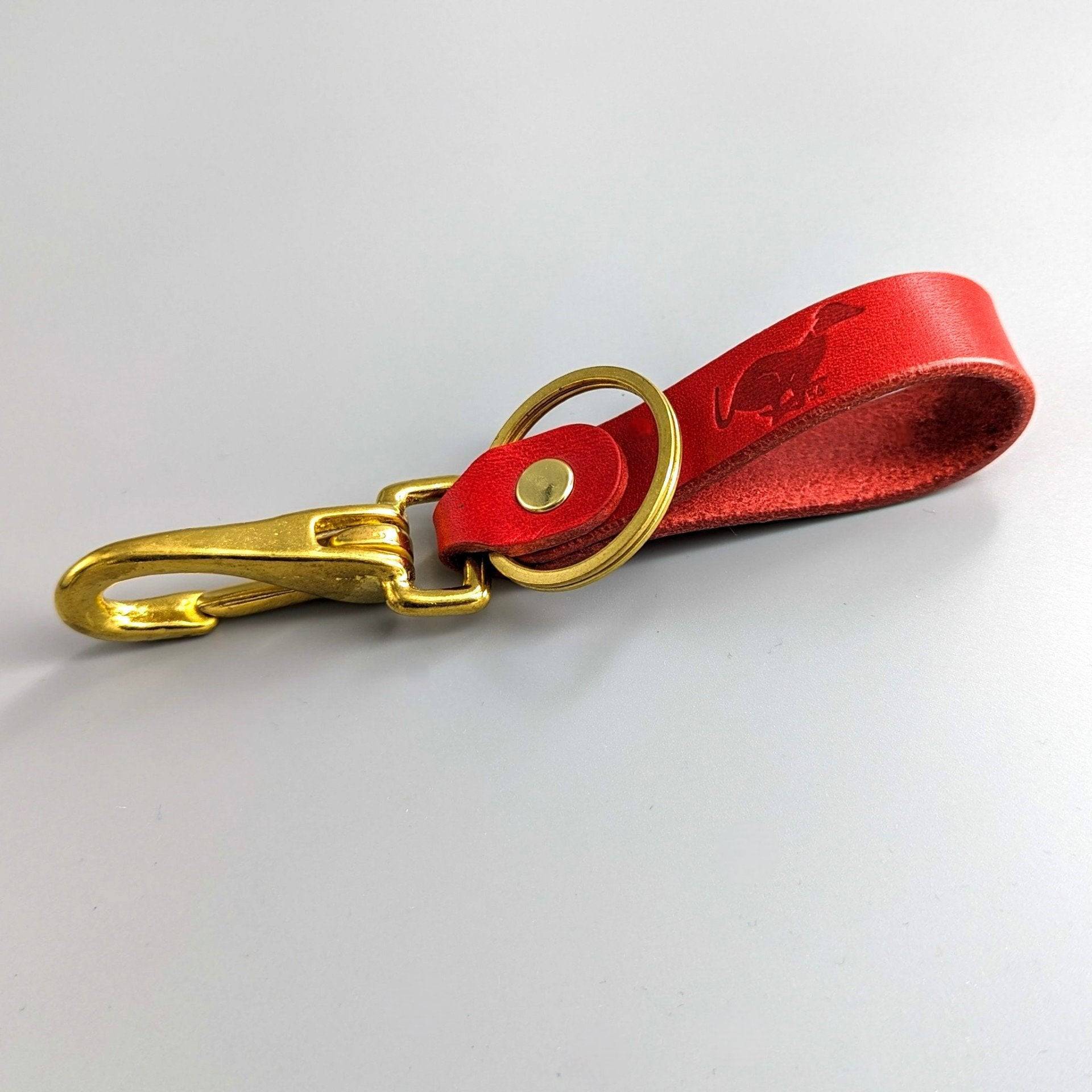 Red personalised British leather keyring with brass swivel hook clasp and visible premium stitching details
