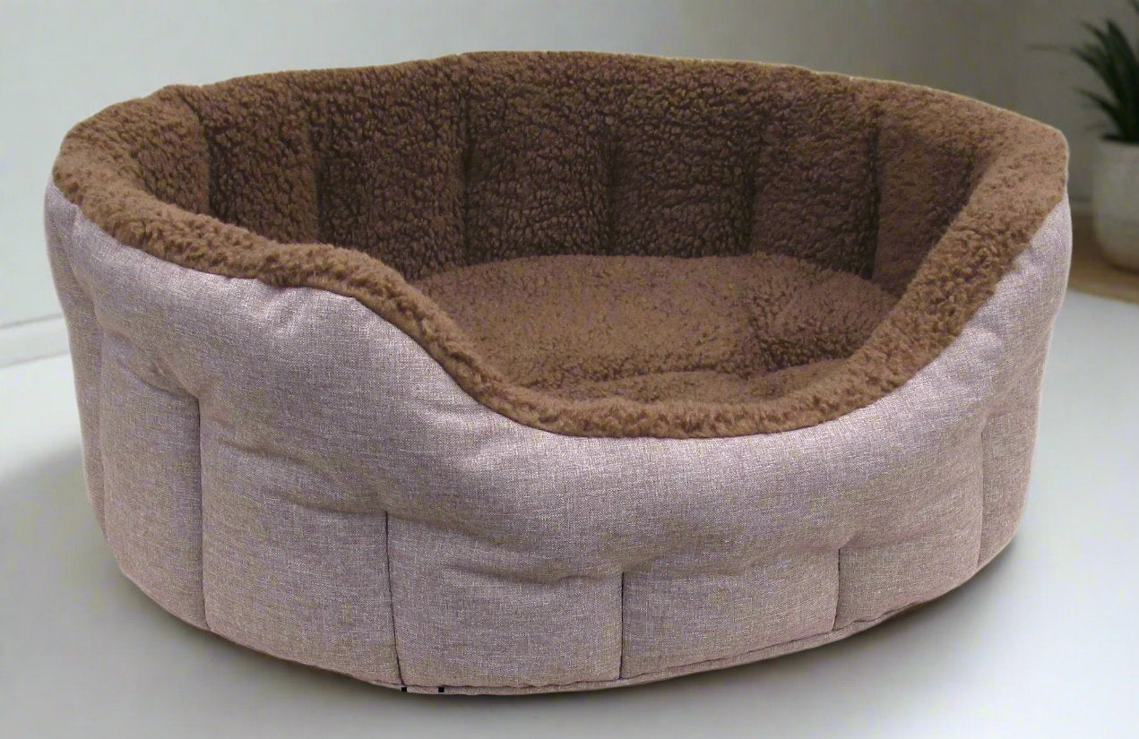 Oval bolster dog bed with fleece lining and beige fabric exterior, machine washable heavy duty pet bedding