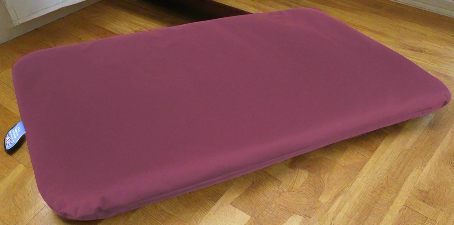 Burgundy waterproof dog bed with heavy duty cover on wooden floor showing durable P&L Country Dog duvet design