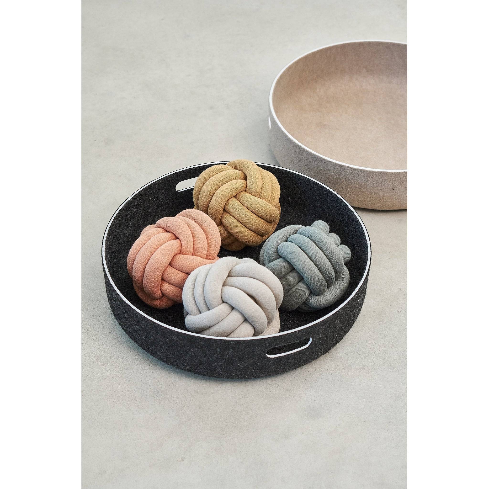 Modern MiaCara Cesto toy basket in charcoal felt displaying four designer knot toys in pink, beige, grey tones