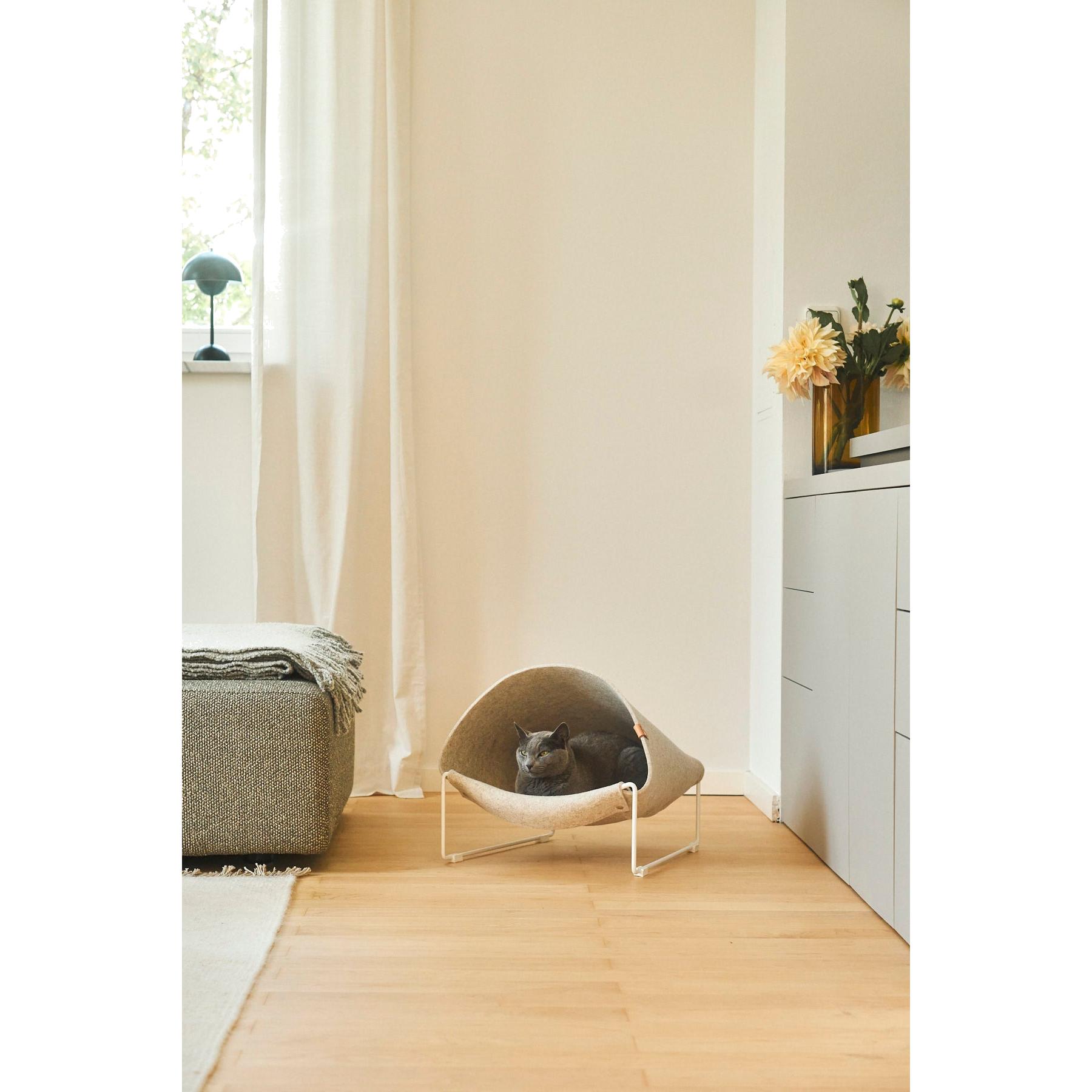 German-designed MiaCara Loggia cat cave with minimalist stand showcases contemporary pet furniture in modern interior