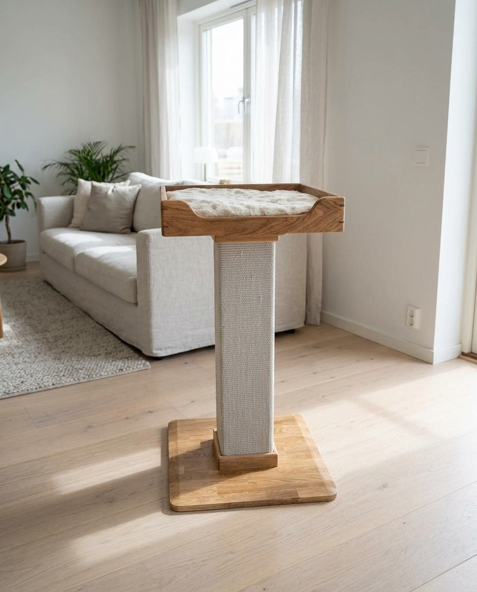 Handmade cat tree with one oak bed on a sisal post and a solid oak base, standing in a living room