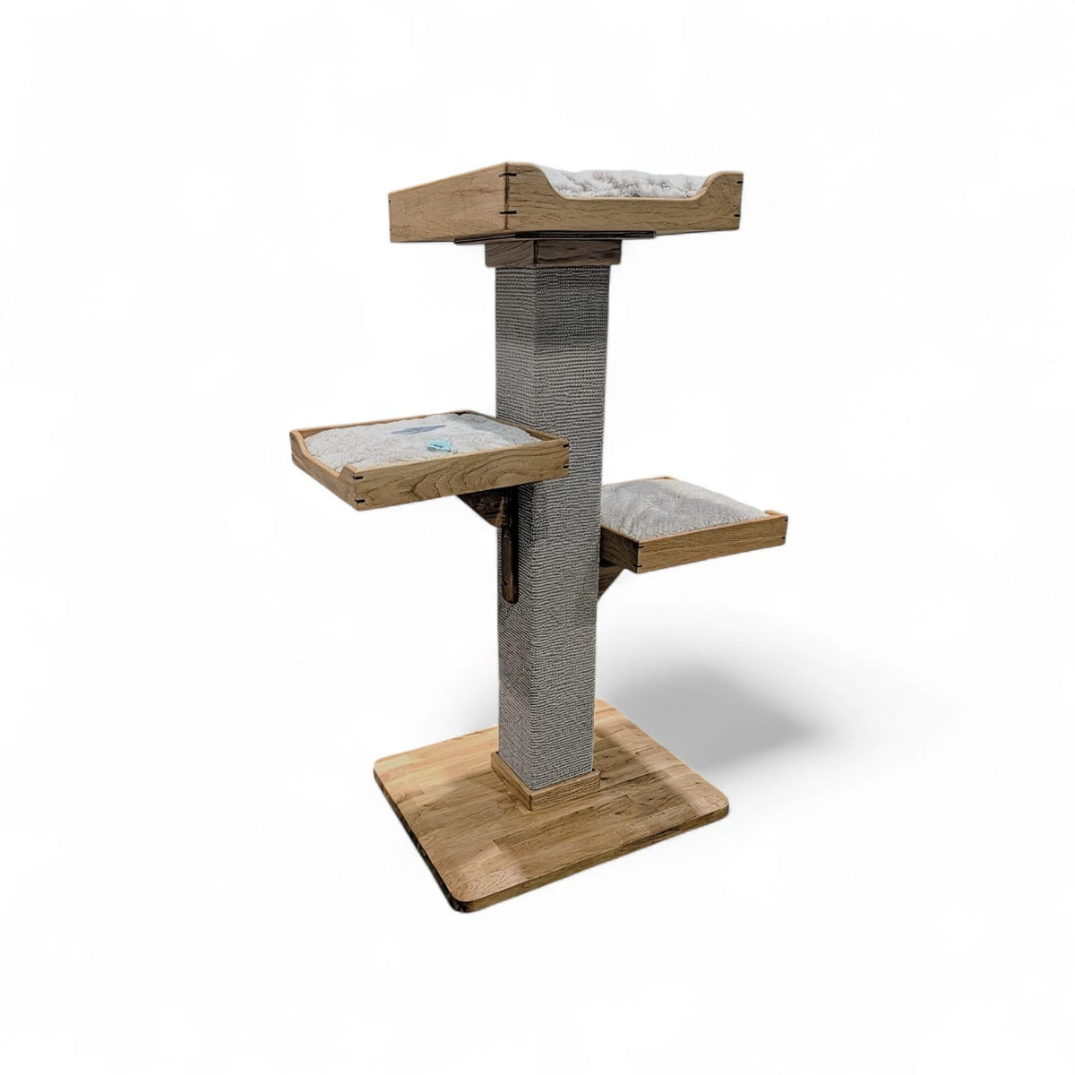 Handmade cat tree with three beds on one sisal carpet post and a solid oak base, on a white background