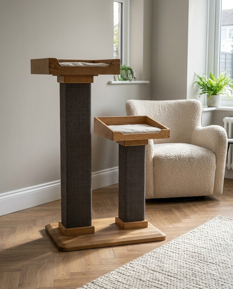 Handmade cat tree with two sisal posts, each topped with an oak bed and a solid oak base, standing in a living room