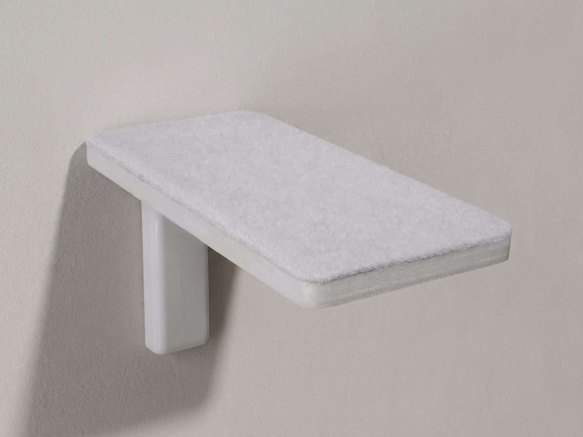 White wall-mounted cat step with textured carpet surface and sturdy support bracket for climbing and perching